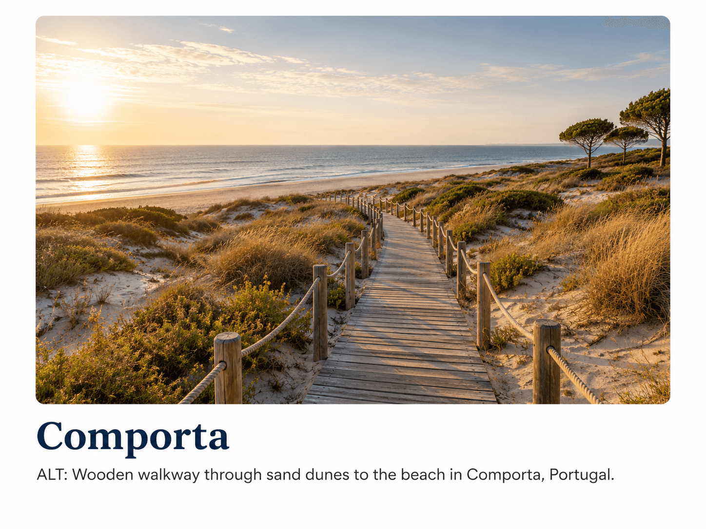Wooden walkway through sand dunes leading to the beach in Comporta, Portugal.